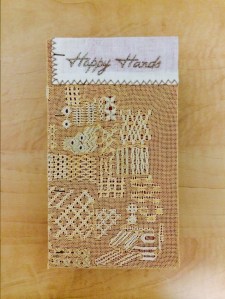 Detail of twentieth century stitching from Happy Hands Studio (Pendelton, Oregon) from unique artist book by Roberta Lavadour called "Happy Hands"